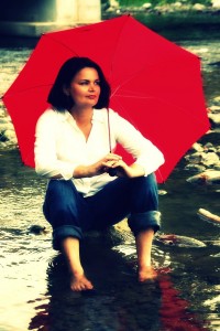 gina sitting rocks umbrella