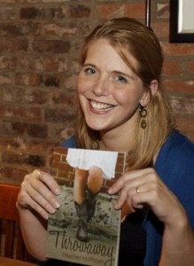 Heather Huffman holding a copy of Throwaway